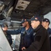 USS Ronald Reagan (CVN 76) Sailors stand watch in the pilot house