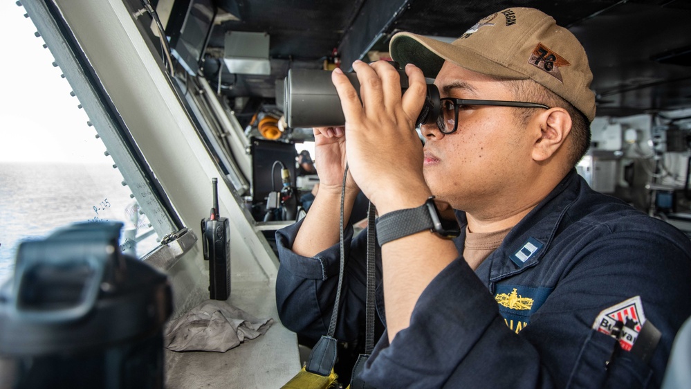 USS Ronald Reagan (CVN 76) Sailors stand watch in the pilot house