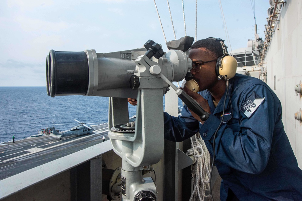 USS Ronald Reagan (CVN 76) Sailors stand watch in the pilot house