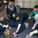 USS Ronald Reagan (CVN 76) Sailors attend stretcher bearer training during general quarters drill