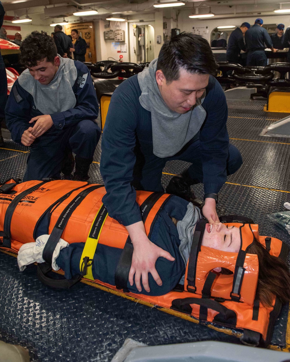 USS Ronald Reagan (CVN 76) Sailors attend stretcher bearer training during general quarters drill