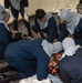 USS Ronald Reagan (CVN 76) Sailors attend stretcher bearer training during general quarters drill