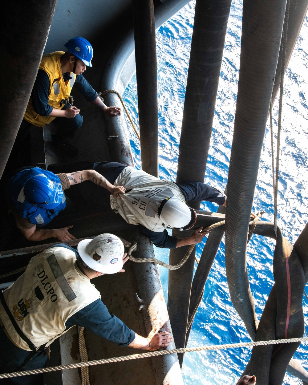 USS Ronald Reagan (CVN 76) conducts fueling-at-sea with USS Ralph  Johnson (DDG 114)