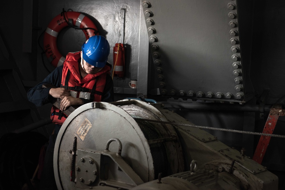 USS Ronald Reagan (CVN 76) conducts fueling-at-sea with USS Ralph  Johnson (DDG 114)