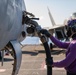 USS Ronald Reagan (CVN 76) conducts fueling-at-sea with Arleigh Burke-class  guided-missile destroyer USS Ralph Johnson (DDG 114)