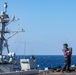USS Ronald Reagan (CVN 76) conducts fueling-at-sea with Arleigh Burke-class  guided-missile destroyer USS Ralph Johnson (DDG 114)