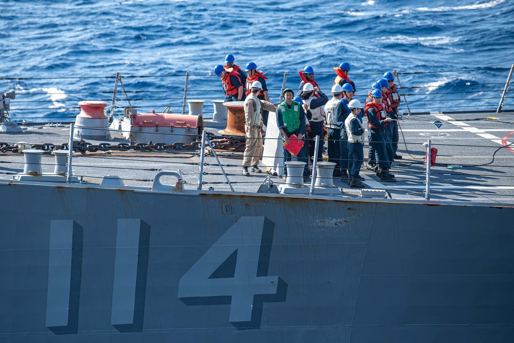 USS Ronald Reagan (CVN 76) conducts fueling-at-sea with Arleigh Burke-class  guided-missile destroyer USS Ralph Johnson (DDG 114)