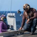 USS Ronald Reagan (CVN 76) conducts fueling-at-sea with Arleigh Burke-class  guided-missile destroyer USS Ralph Johnson (DDG 114)