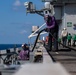 USS Ronald Reagan (CVN 76) conducts fueling-at-sea with Arleigh Burke-class  guided-missile destroyer USS Ralph Johnson (DDG 114)