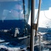 USS Ronald Reagan (CVN 76) conducts fueling-at-sea with  USS Ralph Johnson (DDG 114)