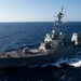 USS Ronald Reagan (CVN 76) conducts fueling-at-sea with  USS Ralph Johnson (DDG 114)