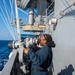 USS Ronald Reagan (CVN 76) conducts fueling-at-sea with  USS Ralph Johnson (DDG 114)
