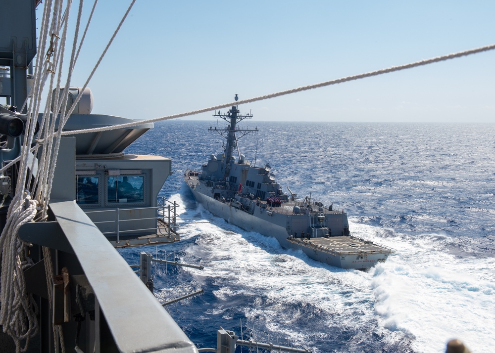 USS Ronald Reagan (CVN 76) conducts fueling-at-sea with  USS Ralph Johnson (DDG 114)