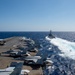 USS Ronald Reagan (CVN 76) conducts fueling-at-sea with  USS Ralph Johnson (DDG 114)