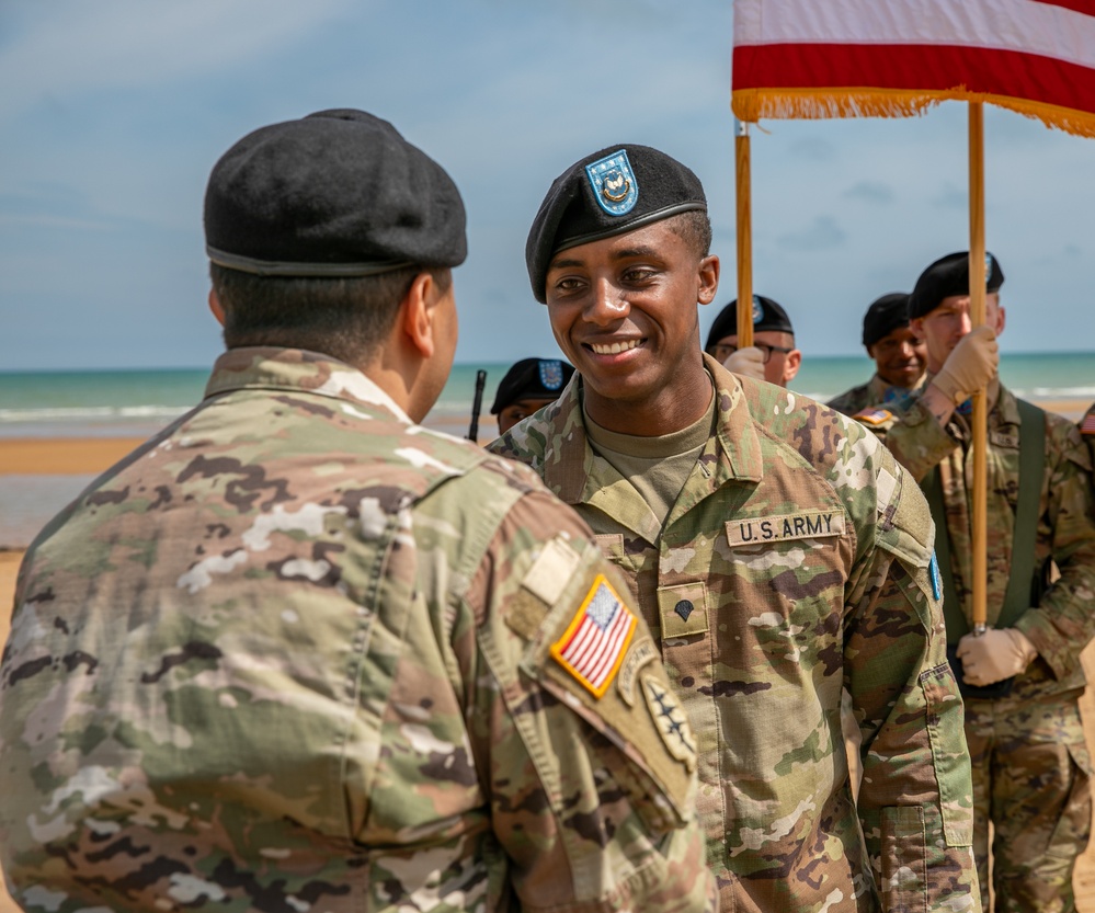 Signal Soldier promotes on Omaha Beach