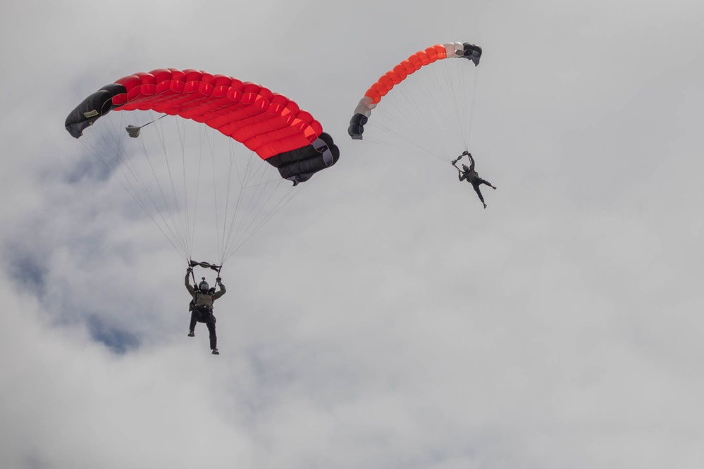 Service members  perform a free-fall jump near Amfreville, France