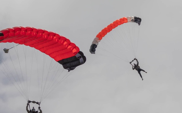 Service members  perform a free-fall jump near Amfreville, France
