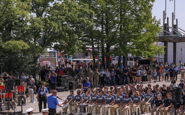 Enlistees raise their right hand at IMS