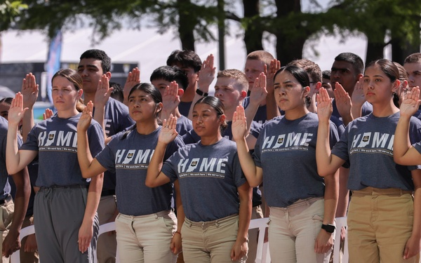 Enlistees raise their right hand at IMS