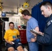 Sailors and staff with U.S. Fleet Forces, Naval Medical Forces Atlantic, Naval Air Force Atlantic and Naval Medical Forces Pacific conduct Quality Medical Assist Visit aboard USS Harry S. Truman (CVN 75)