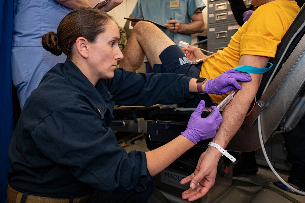 Sailors and staff with U.S. Fleet Forces, Naval Medical Forces Atlantic, Naval Air Force Atlantic and Naval Medical Forces Pacific conduct Quality Medical Assist Visit aboard USS Harry S. Truman (CVN 75)