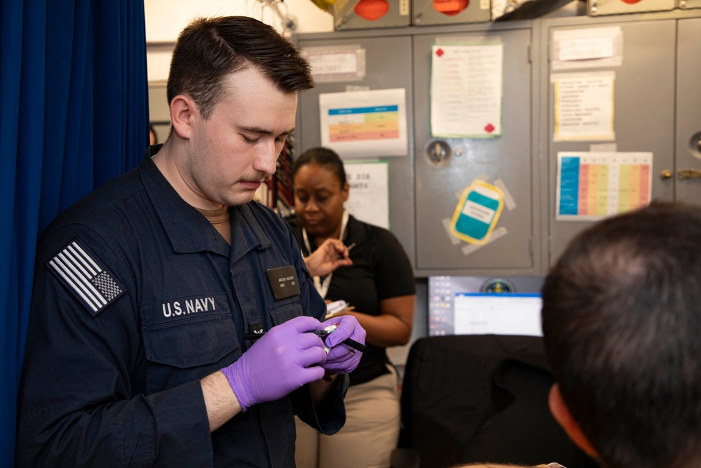 Sailors and staff with U.S. Fleet Forces, Naval Medical Forces Atlantic, Naval Air Force Atlantic and Naval Medical Forces Pacific conduct Quality Medical Assist Visit aboard USS Harry S. Truman (CVN 75)