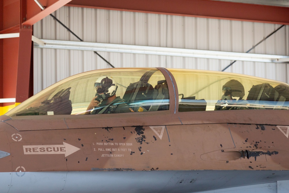 Admiral Aquilino Taxis His Aircraft to Flightline Overhang