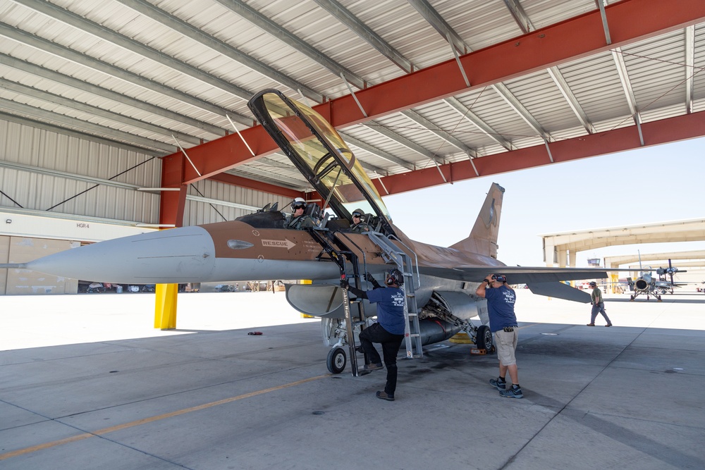 Admiral Aquilino Departs Aircraft After Final Flight