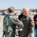 Admiral Aquilino is Greeted by NAWDC Commander, Rear Admiral Spencer