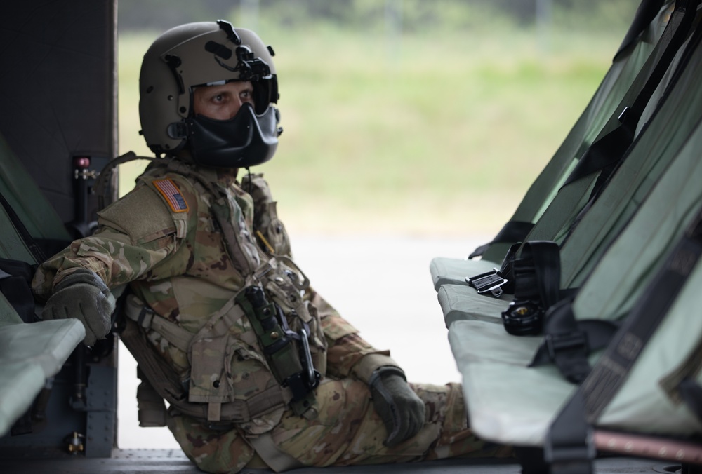 U.S. Army Sgt. Dillon Johnson of Alpha Company, 2-285th Assault Helicopter Battalion, rests for a moment