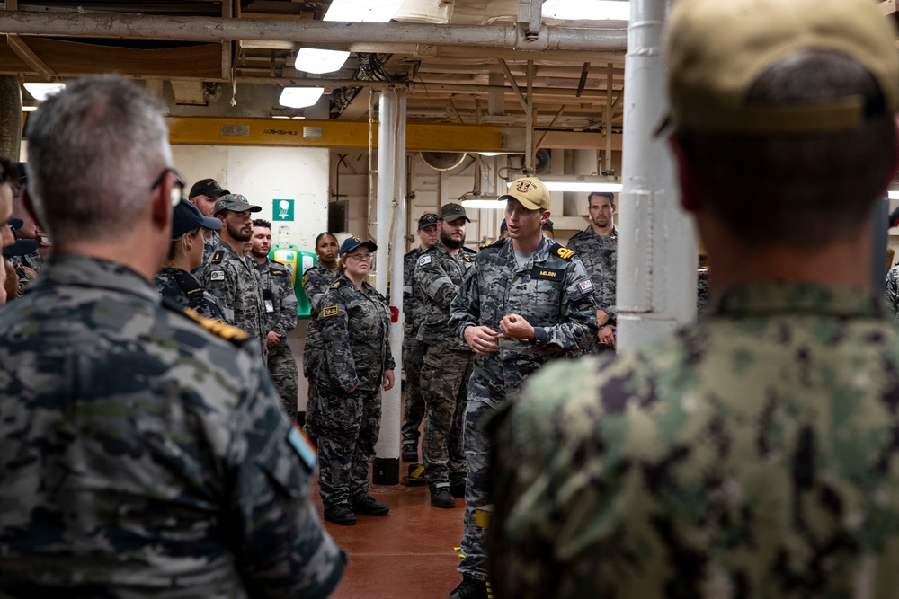 RAN sailors from Fleet Support Unit North, Fleet Logistic Support Element and Port Services during a tour of the tender