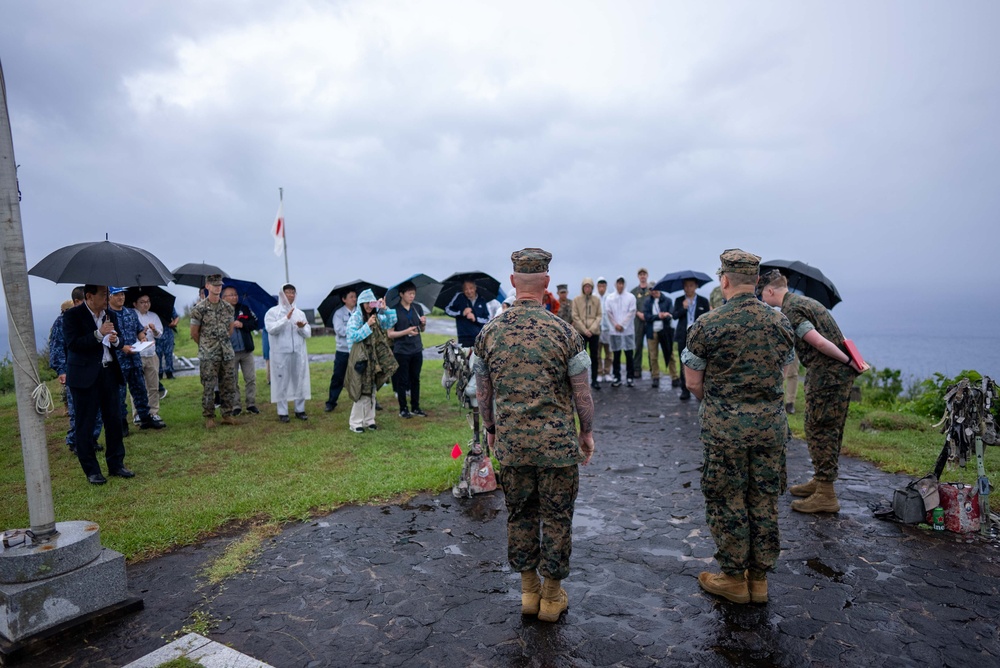 U.S. Marines, Sailors, and Japanese government officials visit Iwo Jima to observe Carrier Air Wing 5 field carrier landing practice.