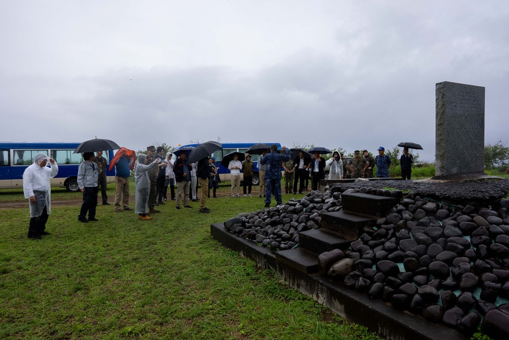 U.S. Marines, Sailors, and Japanese government officials visit Iwo Jima to observe Carrier Air Wing 5 field carrier landing practice.