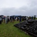 U.S. Marines, Sailors, and Japanese government officials visit Iwo Jima to observe Carrier Air Wing 5 field carrier landing practice.