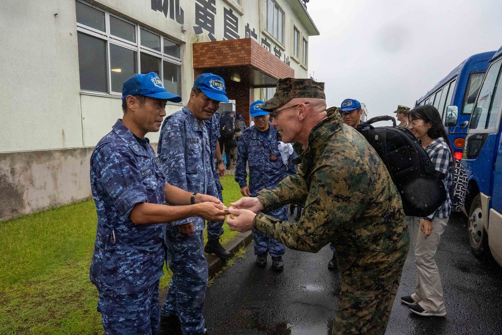 U.S. Marines, Sailors, and Japanese government officials visit Iwo Jima to observe Carrier Air Wing 5 field carrier landing practice.