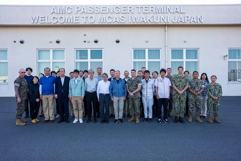 U.S. Marines, Sailors, and Japanese government officials visit Iwo Jima to observe Carrier Air Wing 5 field carrier landing practice.