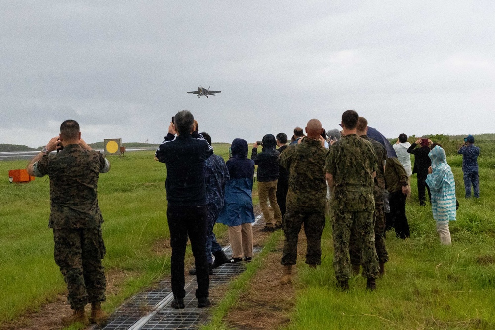 U.S. Marines, Sailors, and Japanese government officials visit Iwo Jima to observe Carrier Air Wing 5 field carrier landing practice.