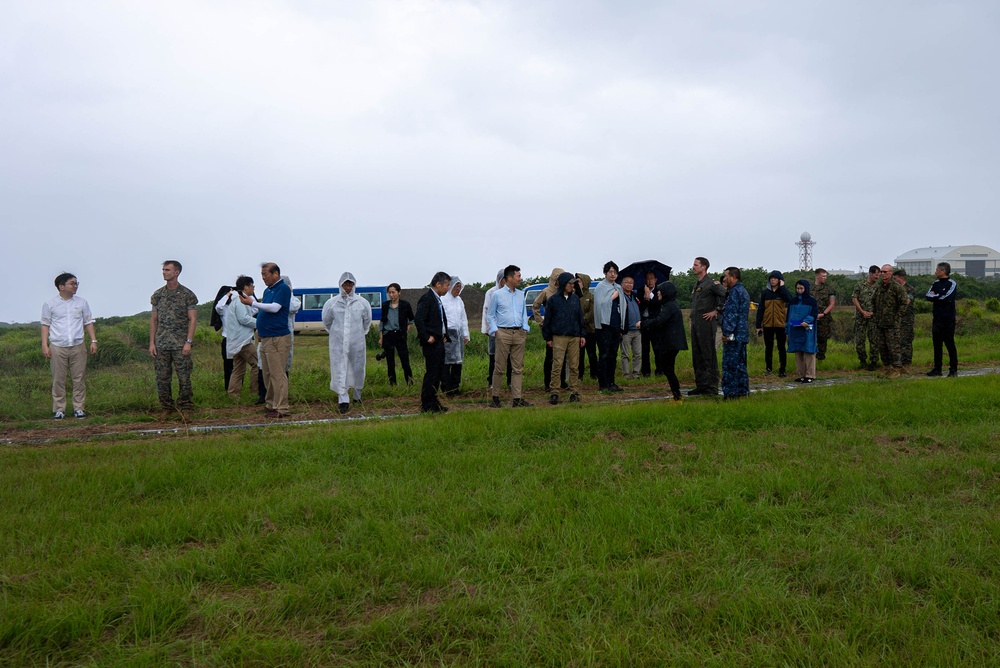 U.S. Marines, Sailors, and Japanese government officials visit Iwo Jima to observe Carrier Air Wing 5 field carrier landing practice.