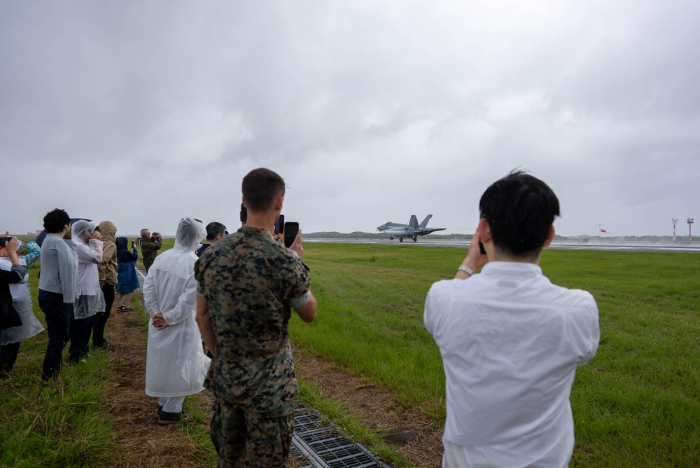 U.S. Marines, Sailors, and Japanese government officials visit Iwo Jima to observe Carrier Air Wing 5 field carrier landing practice.