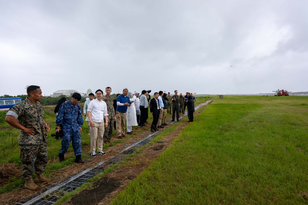 U.S. Marines, Sailors, and Japanese government officials visit Iwo Jima to observe Carrier Air Wing 5 field carrier landing practice.