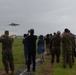 U.S. Marines, Sailors, and Japanese government officials visit Iwo Jima to observe Carrier Air Wing 5 field carrier landing practice.