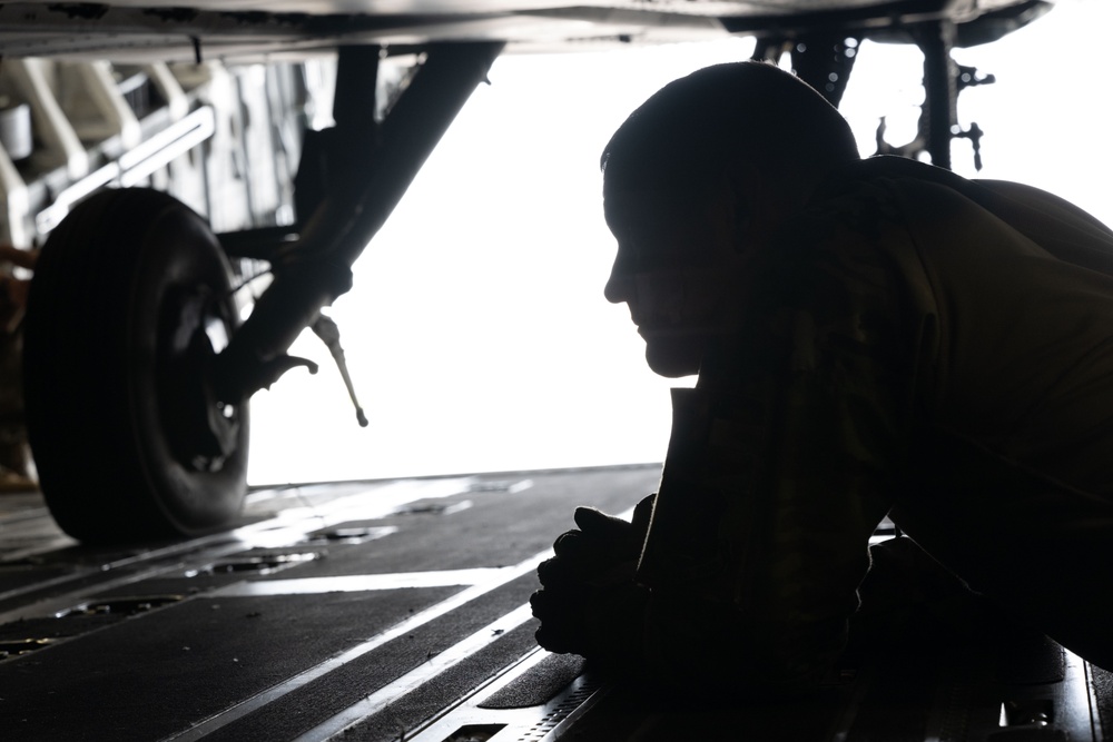 C-17 Globemaster III offload AH-64E Apaches in the USCENTCOM area of responsibility