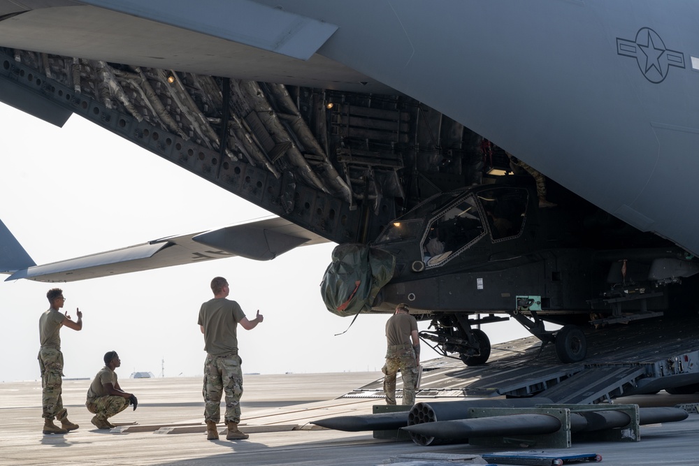 C-17 Globemaster III offload AH-64E Apaches in the USCENTCOM area of responsibility