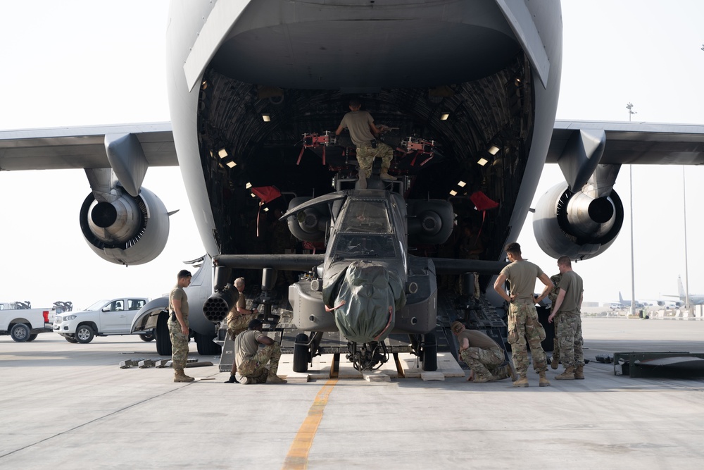 C-17 Globemaster III offload AH-64E Apaches in the USCENTCOM area of responsibility