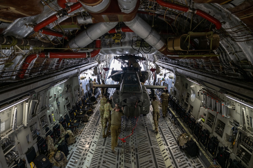 C-17 Globemaster III offload AH-64E Apaches in the USCENTCOM area of responsibility
