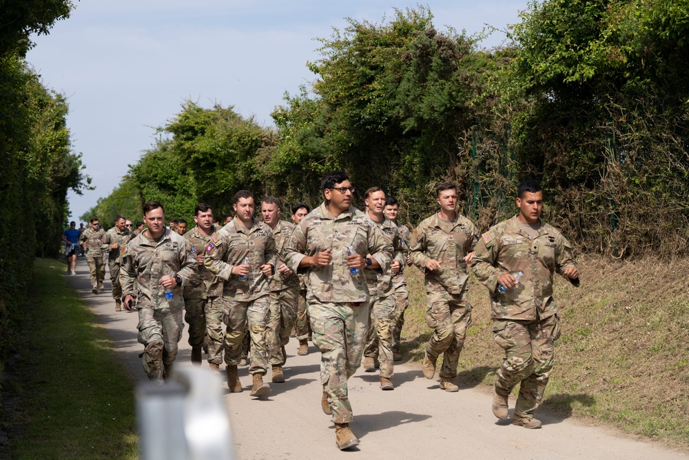 Honoring the Heroes of D-Day: 173rd Airborne Brigade's Tribute Run from Pointe du Hoc to Omaha Beach