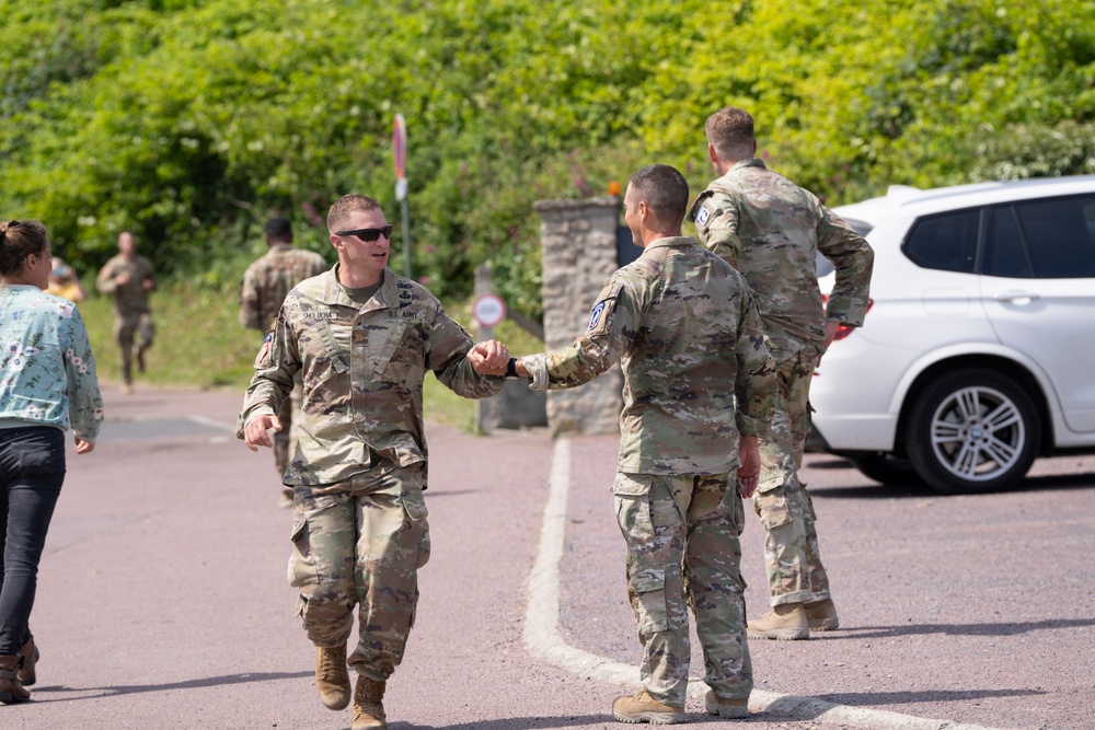 Honoring the Heroes of D-Day: 173rd Airborne Brigade's Tribute Run from Pointe du Hoc to Omaha Beach