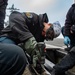 USS Carl Vinson (CVN 70) Sailor Conducts Preventative Maintenance On An Aircraft Catapult