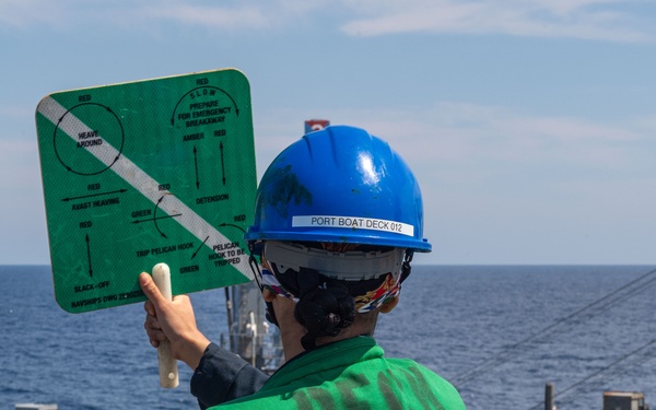USS Ronald Reagan (CVN 76) conducts a fueling-at-sea and replenishment-at-sea with USNS Rappahannock (T-AO 204)