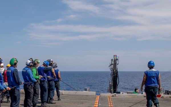 USS Ronald Reagan (CVN 76) conducts a fueling-at-sea and replenishment-at-sea with USNS Rappahannock (T-AO 204)
